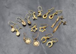 Eight pairs of 9ct gold and yellow metal earrings for pierced ears, including coffee bean, clover