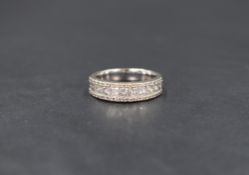 A 14ct white gold diamond band, the central eleven princess cut diamonds measuring approximately 1.