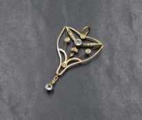 A yellow metal Edwardian style diamond and seed pearl pendant, having a central old cut diamond