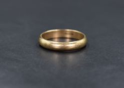 A 9ct gold band, of plain rounded form, ring size U-V, 4.5g