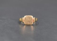 A 9ct gold signet ring, the vacant square panel having moulded shoulders, ring size P, 2.5g