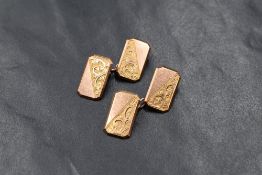 A pair of 9ct rose gold cufflinks, the rectangular panels having half engraved scroll decoration,