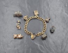 A silver double link charm bracelet having padlock clasp and eight charms, (4 loosse) including car,
