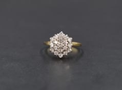 An 18ct gold diamond chip triple cluster ring in a claw set basket mount, ring size N/M and