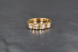 An 18ct gold 4 stone diamond ring, having four matching brilliant cut diamonds, total approx 0.6ct