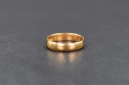 A 22ct gold band, of plain form, ring size L, 5.9g