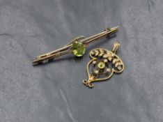 An Edwardian style peridot and seed pearl pendant, having a central round cut bezel set peridot,