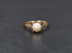 A 9ct gold pearl solitaire ring, the pearl having a white lustre in an eight claw setting, ring size