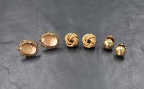 Three pairs of 9ct gold earrings of various designs for pierced ears including knot and facetted