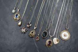 A selection of silver and white metal pendants, most stamped 925/sterling including filligree,