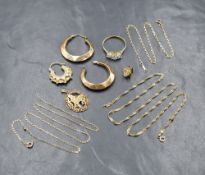 An assortment of 9ct gold jewellery, including a cubic zirconia set ring, three neck chains and hoop