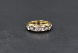 An 18ct gold diamond half eternity band, the six round brilliant cut diamonds having an