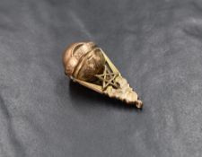 A rose metal Masonic pendant, having decorative engraving along with Masonic symbols and a revolving