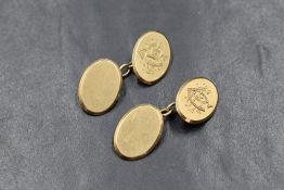 A pair of 9ct gold cufflinks, the oval panels having 'CRE' monogram to one side with chain