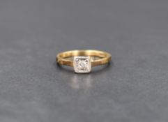 An 18ct gold diamond solitaire ring, the illusion set round cut diamond measuring approx 0.10ct in a