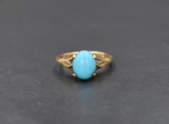 A 9ct gold turquoise ring, the oval turquoise cabochon in a four claw setting with decorative