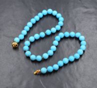 A short string of turquoise glazed beads having an 18ct gold tongue and ball clasp, approx 18'