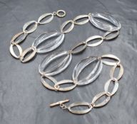 A Braybrook & Britten silver and clear resin open looped necklace having loop and bar clasp, with