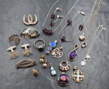 An assortment of silver jewellery, including cabochon set pendants, a Mexican silver dried flower