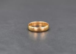 A 22ct gold band, of plain form, ring size L, 3.5g