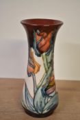 A Moorcroft pottery Red Tulip pattern vase, designed by Sally Tuffin, painted by Sharon Austin,
