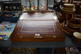 A Victorian brass bound mahogany writing slope with fitted interior and glass ink well. Condition:
