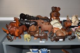A large collection of carved wooden animal figures, to include frogs, pigs, rhinos ect, ( 30 )