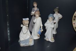 Five Lladro and Nao by Lladro porcelain figurines comprising 'How Pretty' number 1110, 'Angel with