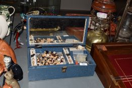 A blue faux leather jewellery box, containing a collection of costume jewellery including beaded