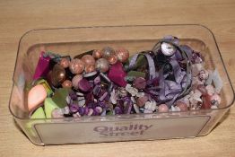 A collection of beaded jewellery, including a rose quartz and rhodonite example, along with