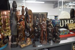 A large group of carved African tribal figures, largest h37cm