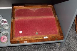 A 19th century burr wood writing box, having brass corners and red velvet interior, w50cm