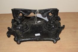 A 19th century cast iron boot scrapper in original black paint, w31cm