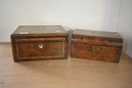 A 19th century travelling writing box decorated with mother-of-pearl and geometric inlay border,