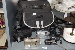 A Samsung GX camera with carry bag, h20cm, sold together with a Fujifilm camera, a medion digital