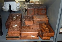 A large group of various carved wooden boxes, to include an hexagonal trinket box having geometrical