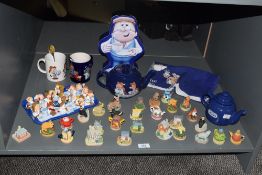 A large group of Tetley tea advertising mascots, to include tea / coffee pots, biscuit tin ect, sold
