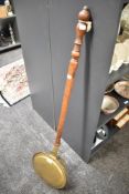 A 19th century copper and brass bed warmer, L114cm