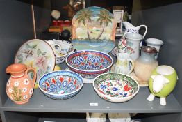 A large group of ceramic plates and jugs, to include a sheep planter, a Bourton stoneware jug, a