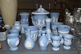 A collection of Wedgwood Jasper ware, decorated in blue and white sprigged with classical motifs, to