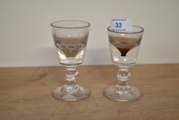A near pair of 19th century deception glasses having a bucket bowl form and conical foot, largest