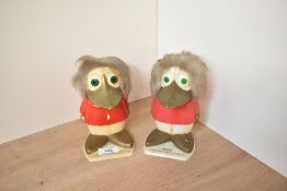 A pair of novelty TSB plastic duck money banks, one holding coins, h15cm