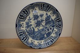 A large Chinese blue and white Willow pattern plate, W36cm