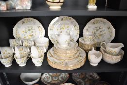 A fine bone China Colclough pattern part dinner service, decorated having yellow and blue foliage on