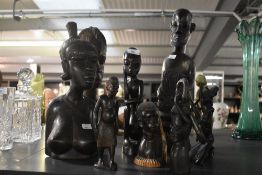 A group of African tribal figures, hand carved in ebony, to include a female bust ect, ( 8 ).