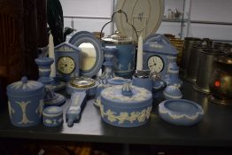 A group of Wedgwood Jasperware, decorated in blue and white sprigged with carved classical motifs,
