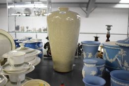 A large 20th century colossal style ceramic vase, decorated in crackle glaze on a cream ground,