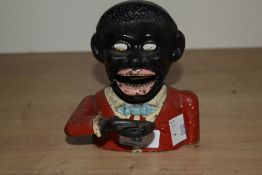 A vintage cast painted Jolly Gent bank money box, h13.5cm