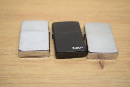 Three Zippo lighters, comprising a Chrome 1990, a Chrome 1989 and a Black 1987