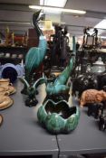 A collection of Canadian blue mountain pottery figures, to include a lotus flower bowl, flying